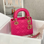 Pink quilted Dior handbag with top handles and gold hardware, small size
