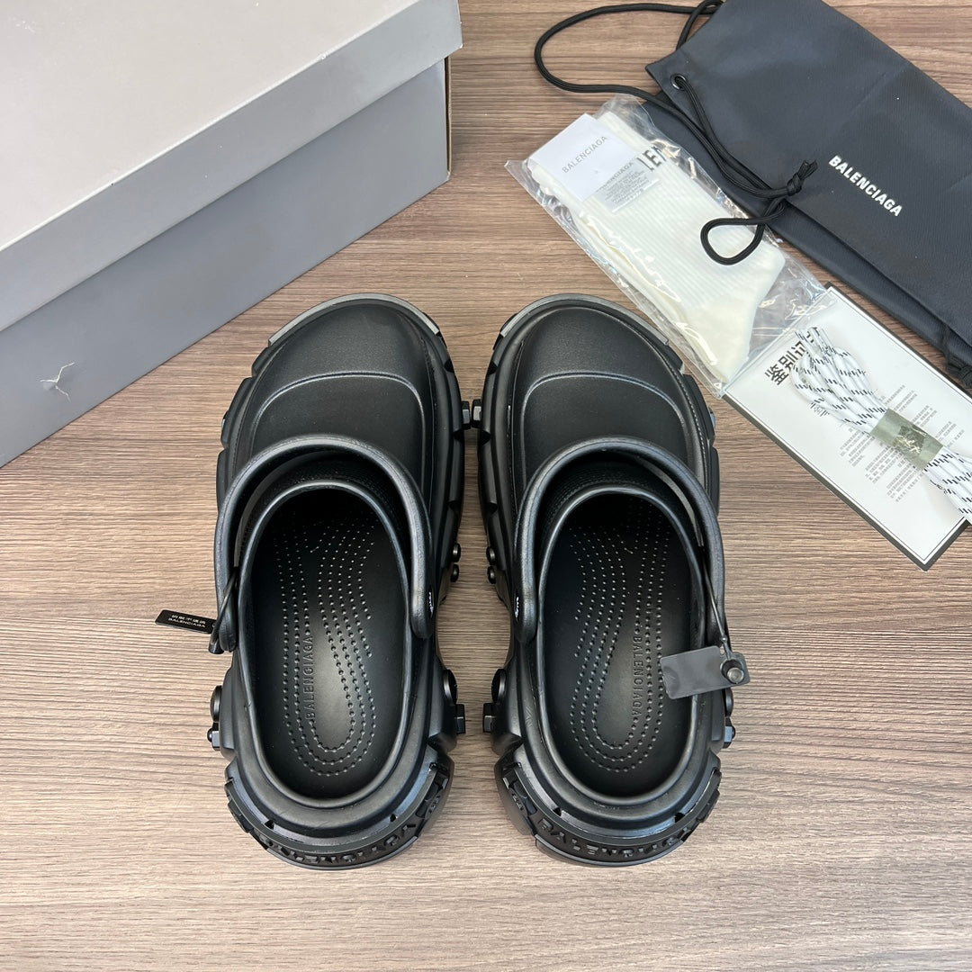 Clog-style sandals pair, open-toe design with perforated footbeds, dark gray