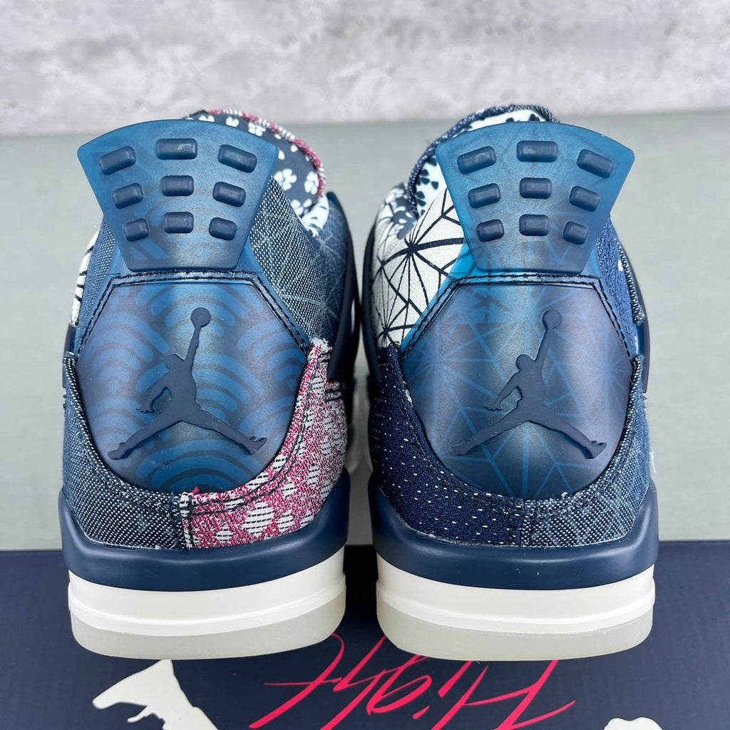 Rear view of navy sneakers showing blue-tinted insoles and dark heel tread