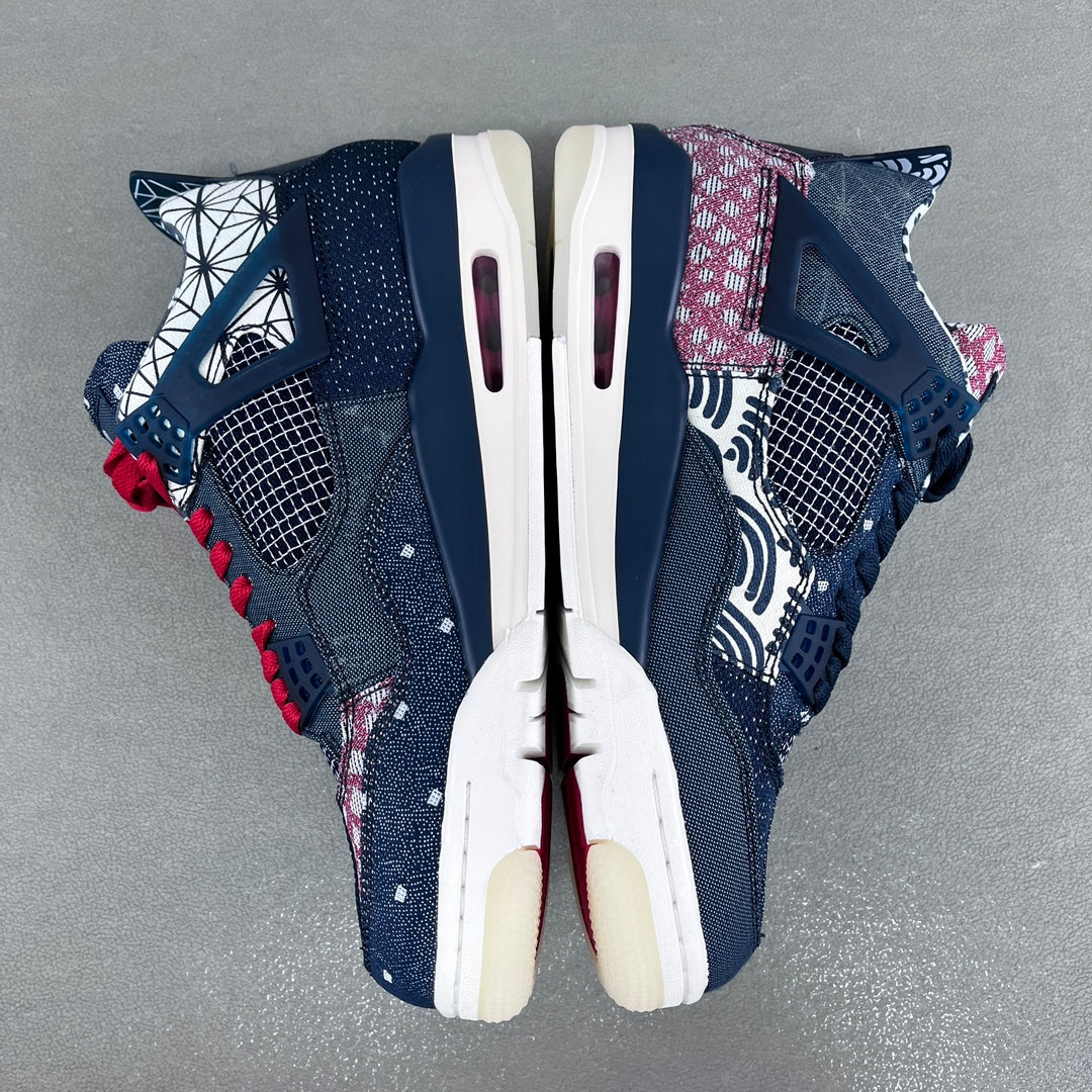 Top-down view of navy sneakers with red lace accents, white midsoles, and vents