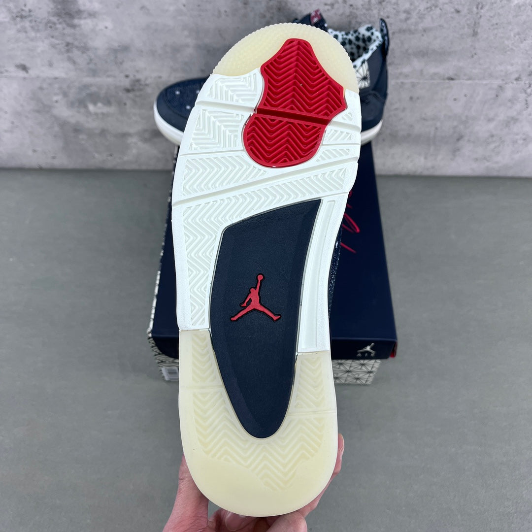 Back view of navy sneaker with white sole, red Jumpman logo, and treaded heel