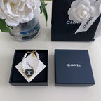 Heart charm pearl-bead bracelet in a navy gift box with card