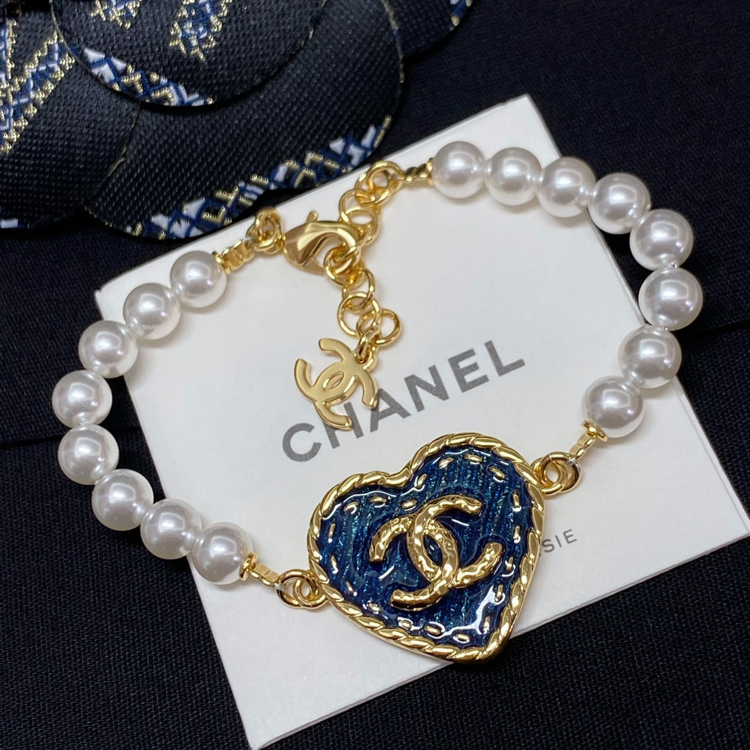 Blue heart charm pearl-bead bracelet with gold links and CHANEL logo card