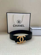 Dark leather Chanel belt with gold CC-style buckle featuring pink and clear stone detail