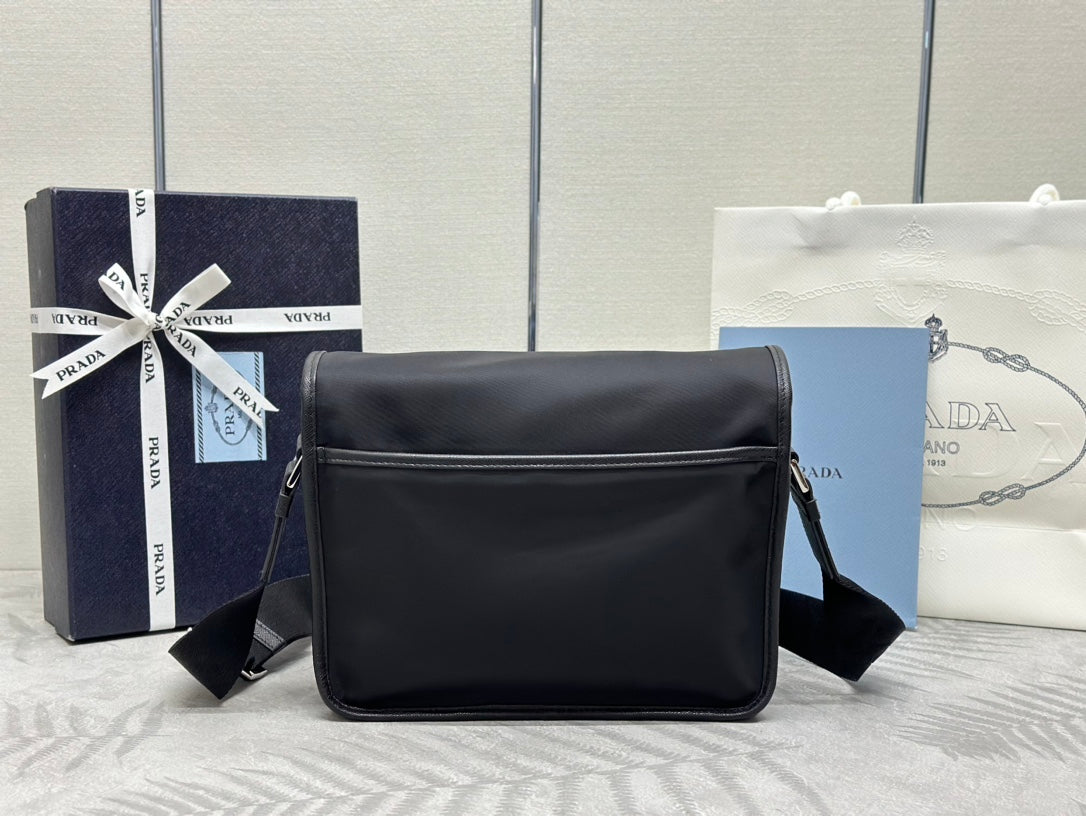 Prada boxy crossbody bag with curved top flap and shoulder strap, black