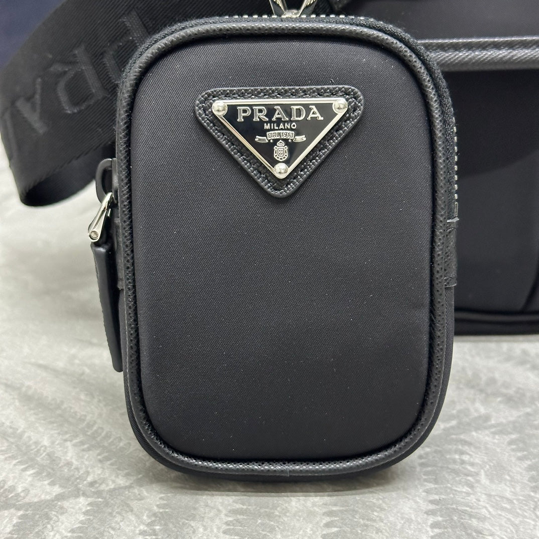 Prada mini pouch with triangular logo patch and zip closure, black