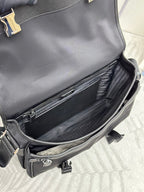 Prada bag open view showing interior compartment and zip pocket