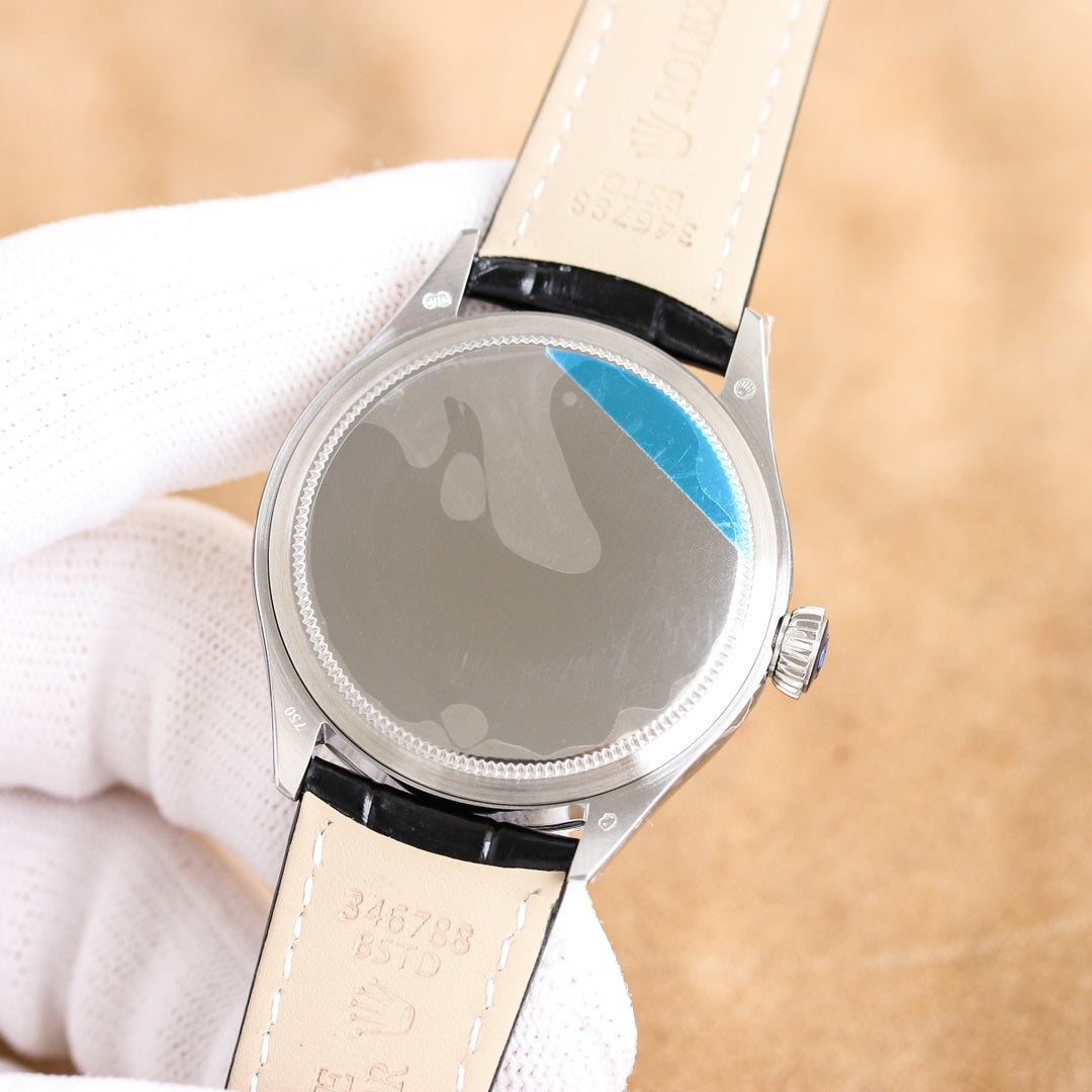 Rolex wristwatch caseback with light leather strap, engraved markings and blue-tinted insert
