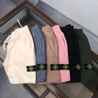 Stone Island shorts in assorted colors—white, blue, tan, pink, black, green—logo patches