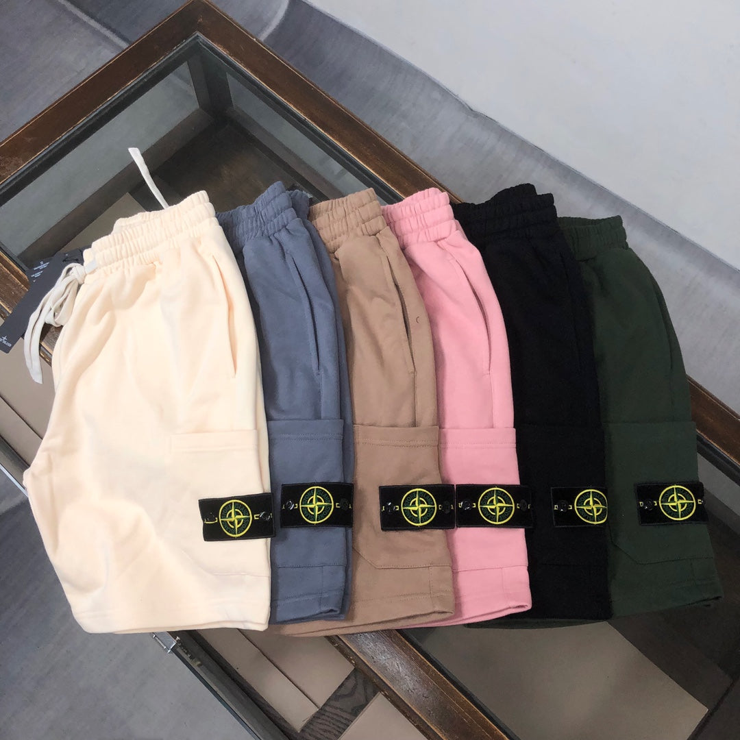 Stone Island shorts in assorted colors—white, blue, tan, pink, black, green—logo patches