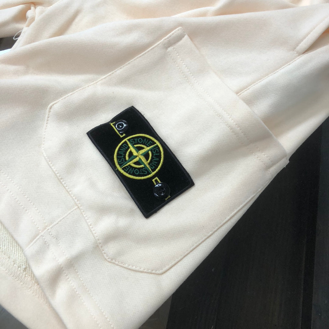 Off-white shorts with Stone Island logo patch on front pocket