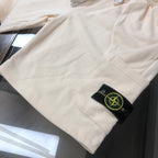 Off-white shorts with Stone Island logo patch on side pocket