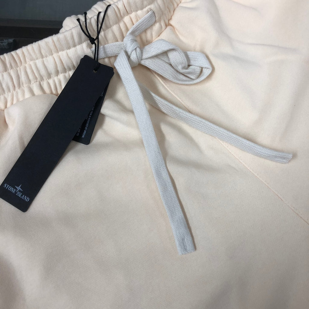 Off-white elastic waistband shorts with blue drawstring and black size tag