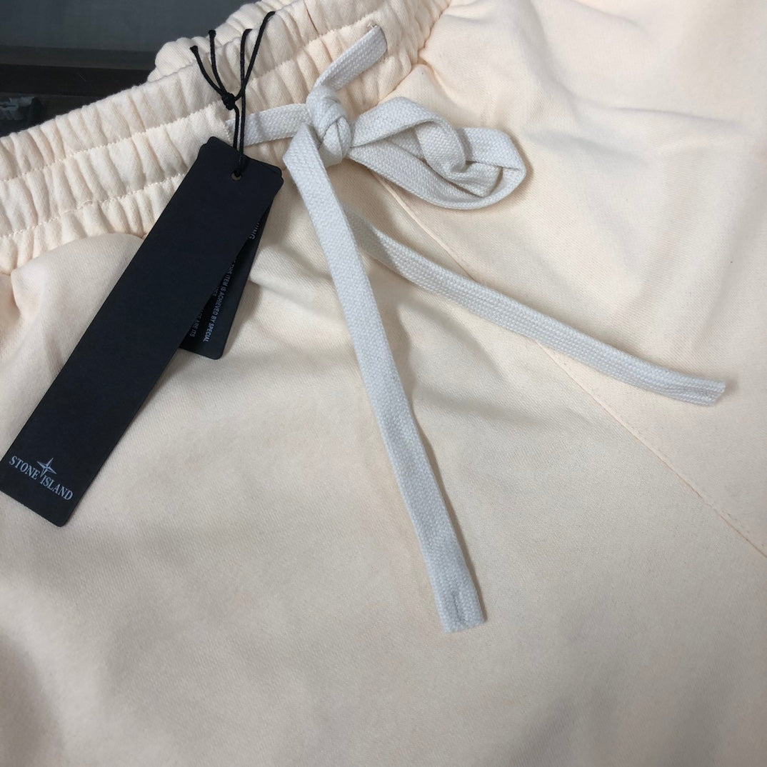 Off-white elastic waistband shorts with blue drawstring and black size tag