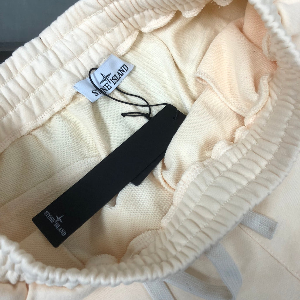Off-white elastic waistband shorts with interior label and drawstring tie