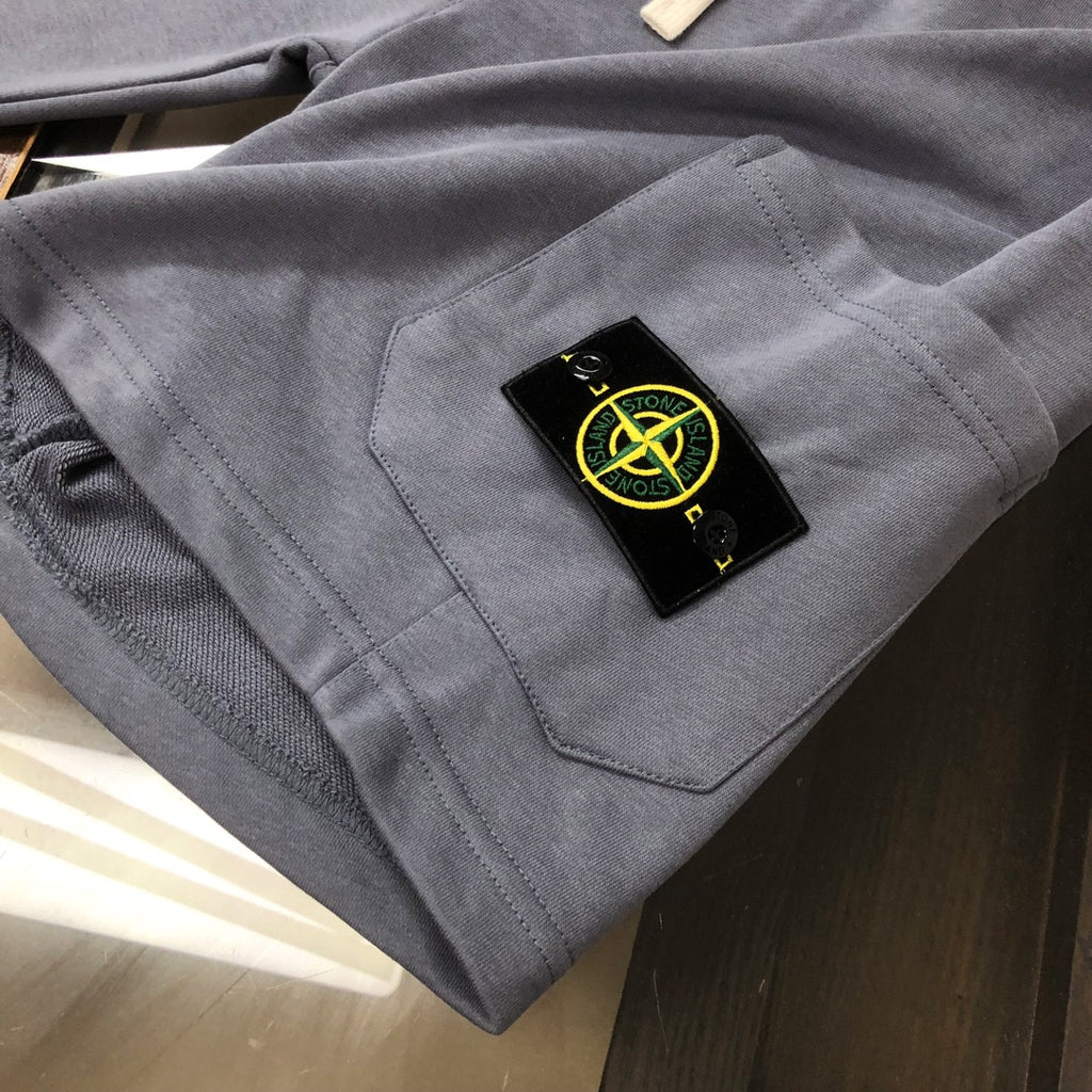 Stone Island shorts, gray with stitched pocket and black Stone Island patch