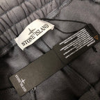 Stone Island shorts inner waist with care labels on gray fabric