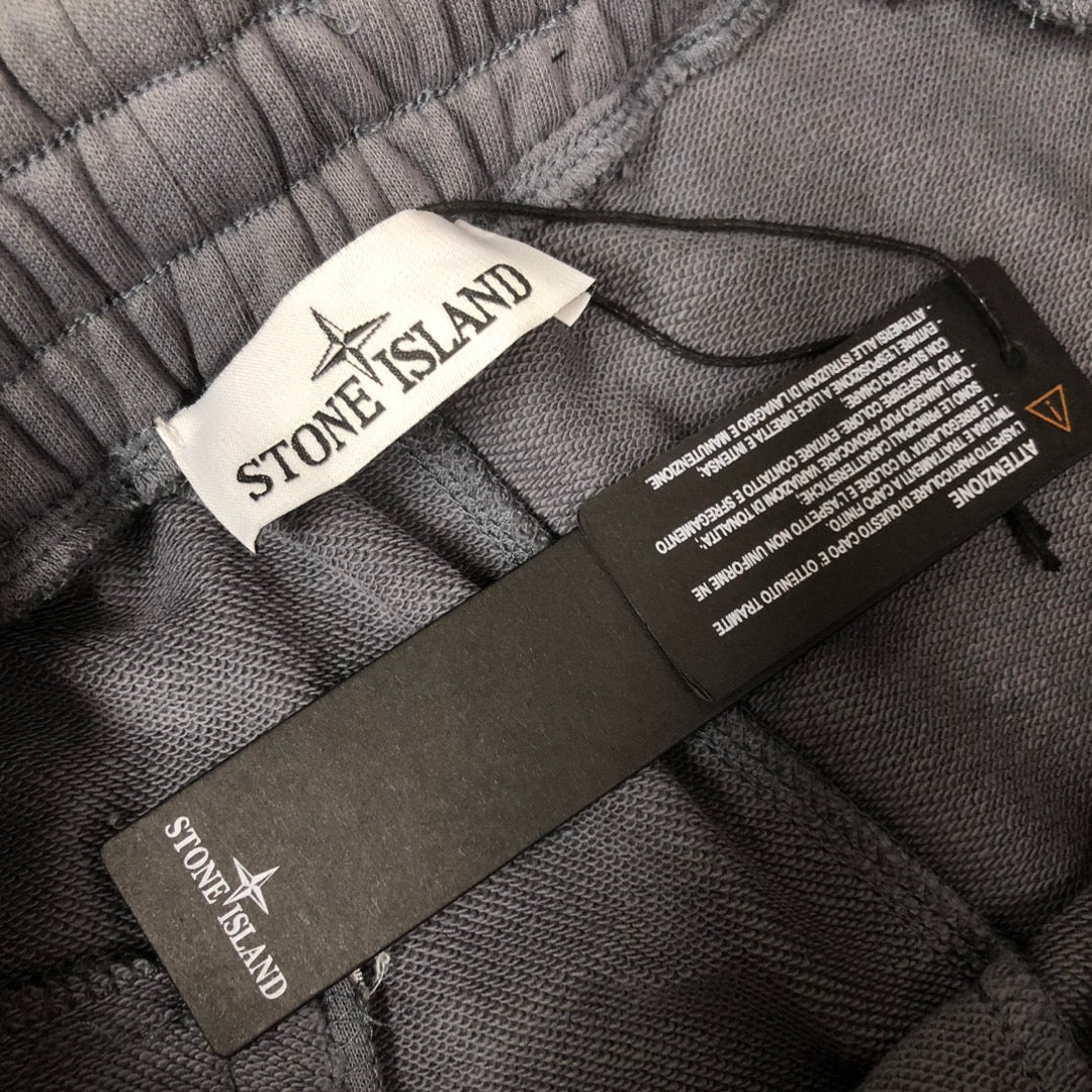 Stone Island shorts inner waist with care labels on gray fabric