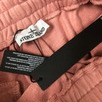 Stone Island pink shorts care tag on elastic waistband