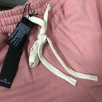 Stone Island pink shorts close-up of white drawstring and elastic waistband