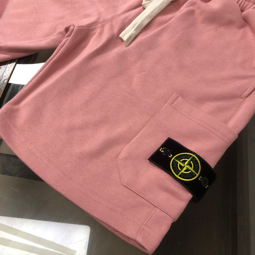 Stone Island pink shorts with side pocket, stitched seams, and logo label