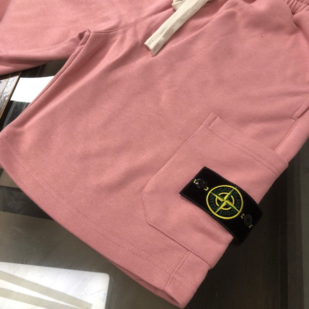 Stone Island pink shorts with side pocket, stitched seams, and logo label