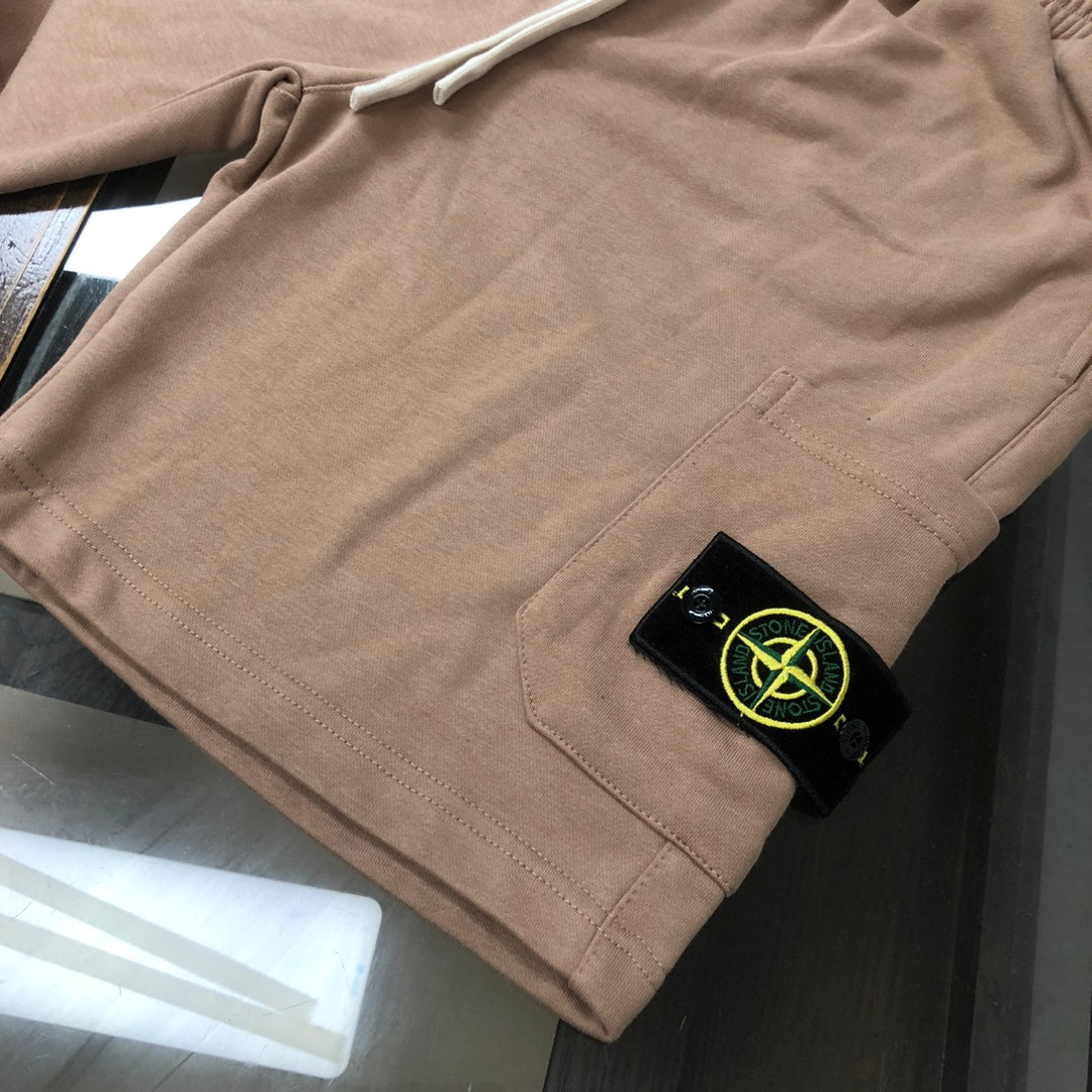 Stone Island beige shorts with black logo patch on front pocket