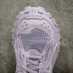 Front of lilac sneaker showing mesh toe, stitched overlays, and lace-up