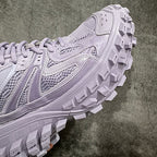 Lilac sneaker side view with mesh panels and thick lug outsole