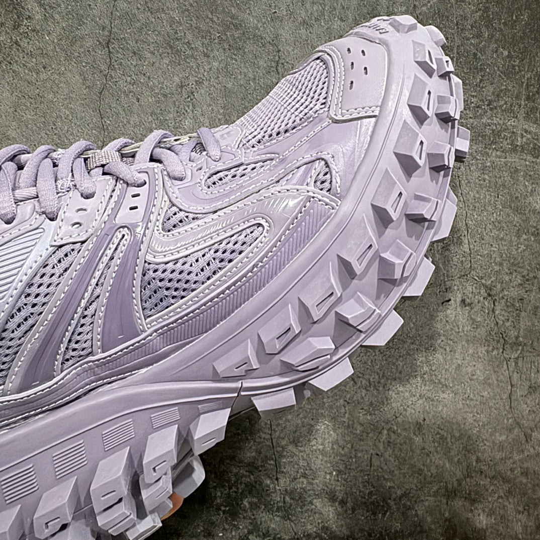 Lilac sneaker side view with mesh panels and thick lug outsole
