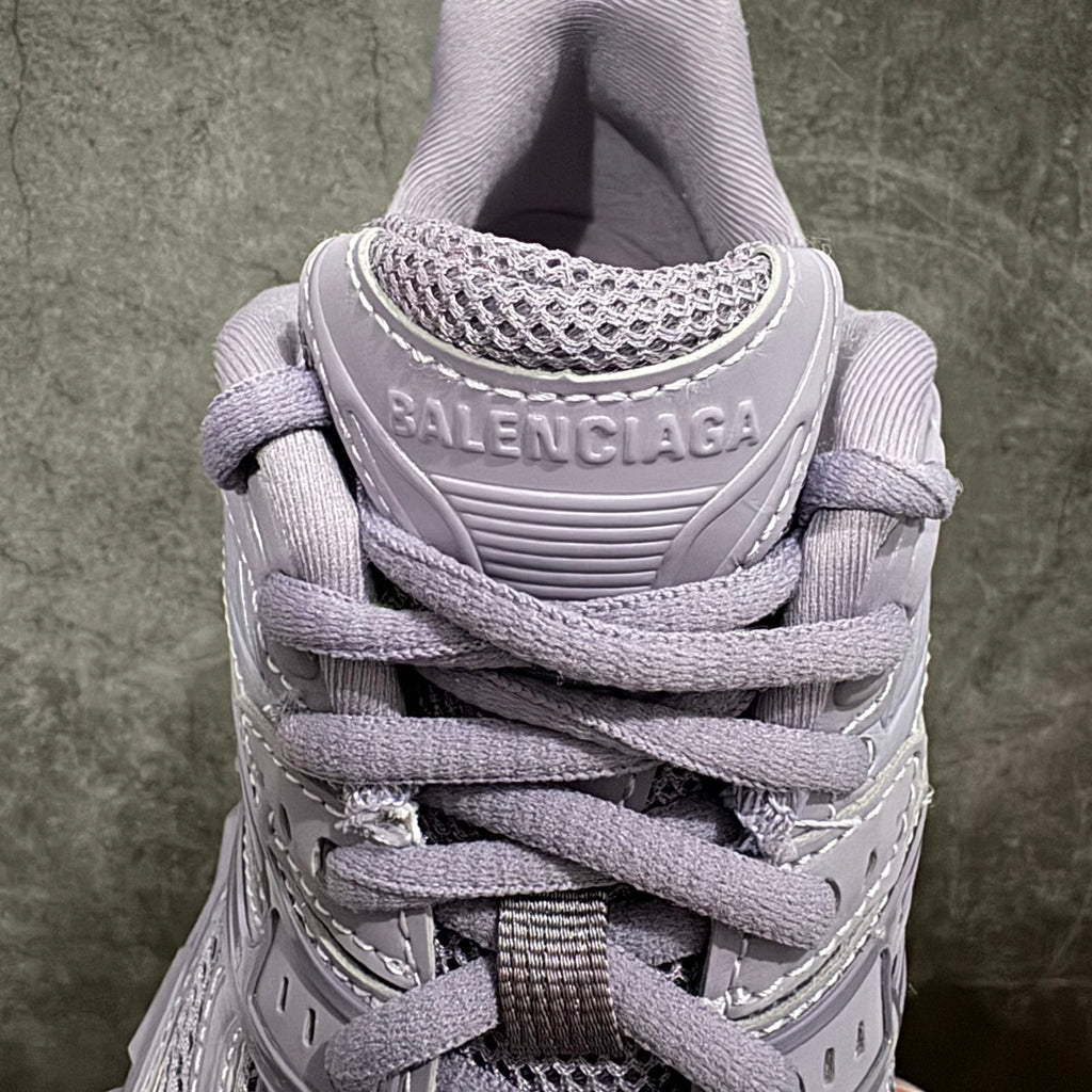 Lavender Balenciaga lace-up sneaker back view with logo patch and mesh collar