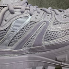 Lavender Balenciaga side view with stitched stripes, mesh panels, and thick tread sole