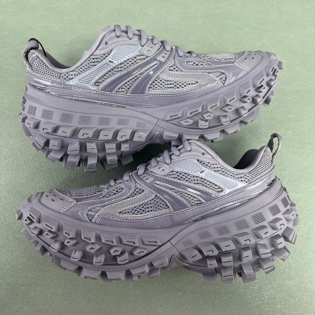 Lavender lace-up chunky trail sneakers with perforated mesh upper and deep tread sole