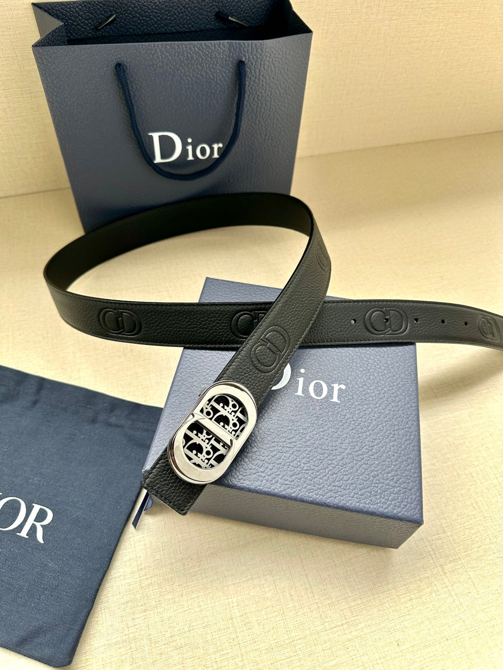 Dior belt looped with dark leather strap and silver-tone oval logo buckle