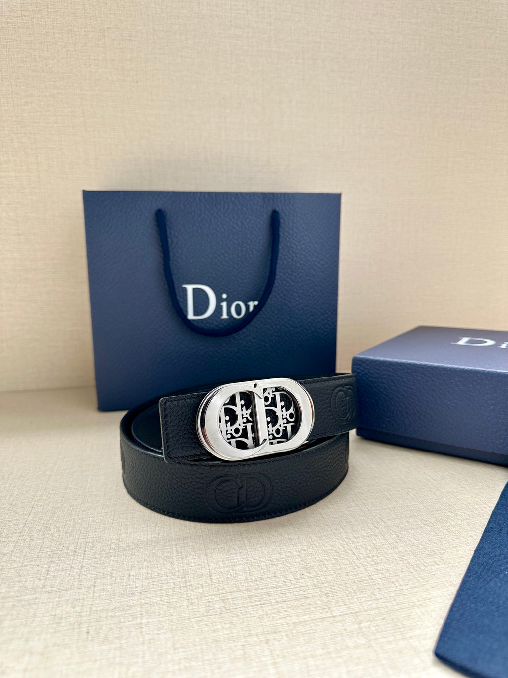 Dior belt with dark leather strap and silver-tone oval logo buckle