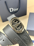 Dior belt detail: textured dark leather with silver-tone oval monogram buckle
