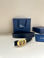 Dior belt featuring dark leather with oval logo buckle and double-ring strap ends