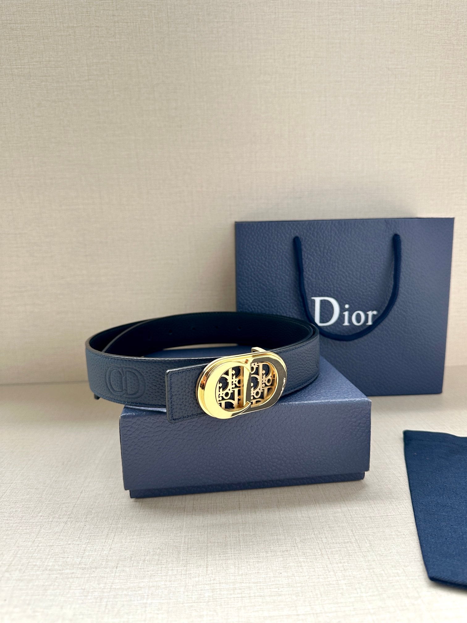 Dior leather belt with dark blue strap and gold-tone logo buckle