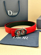 Red leather belt with silver-tone oval logo buckle and embossed strap markings