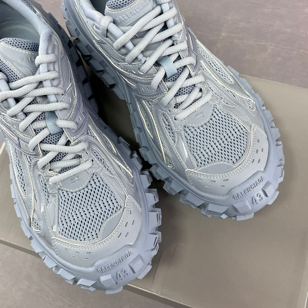 Light gray Balenciaga lace-up sneakers, front mesh and stitched overlays, chunky sole