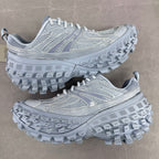 Light gray Balenciaga lace-up chunky sneakers, side view with molded tread sole