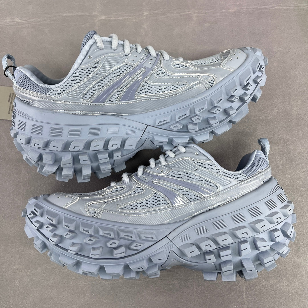 Light gray Balenciaga lace-up chunky sneakers, side view with molded tread sole