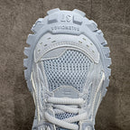 Light blue platform sneaker tongue and lace area with mesh upper detail