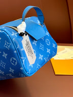 Louis Vuitton blue monogram bag with hanging tag and top handle