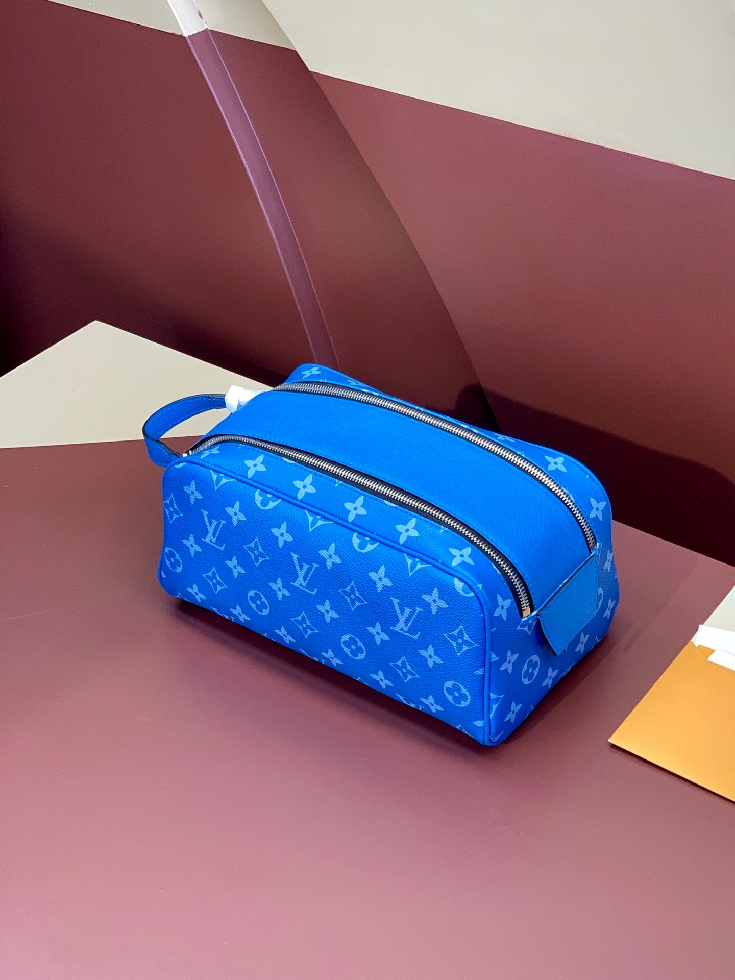Louis Vuitton blue monogram mini bag with top zip and wrist strap