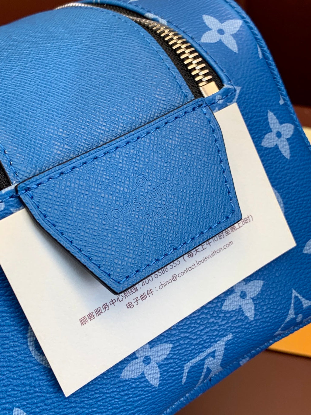 Louis Vuitton blue monogram zip bag with front leather panel and label