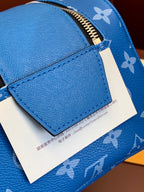 Louis Vuitton blue monogram zip bag with front leather panel and label