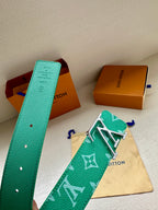 Louis Vuitton green monogram belt with gold-tone LV buckle, shown with pouch