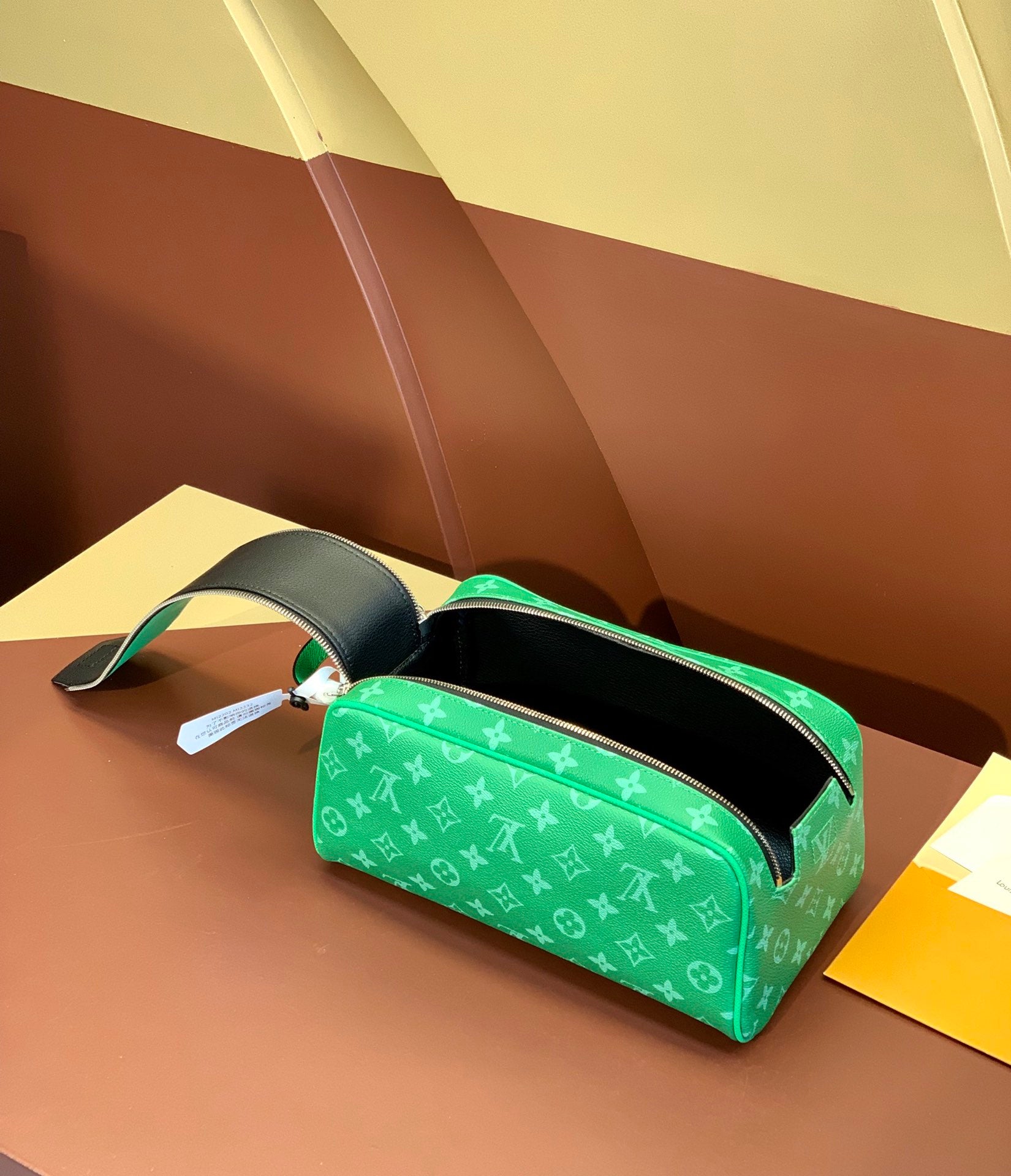 Louis Vuitton monogram belt bag with hanging tag, bright green and black lining