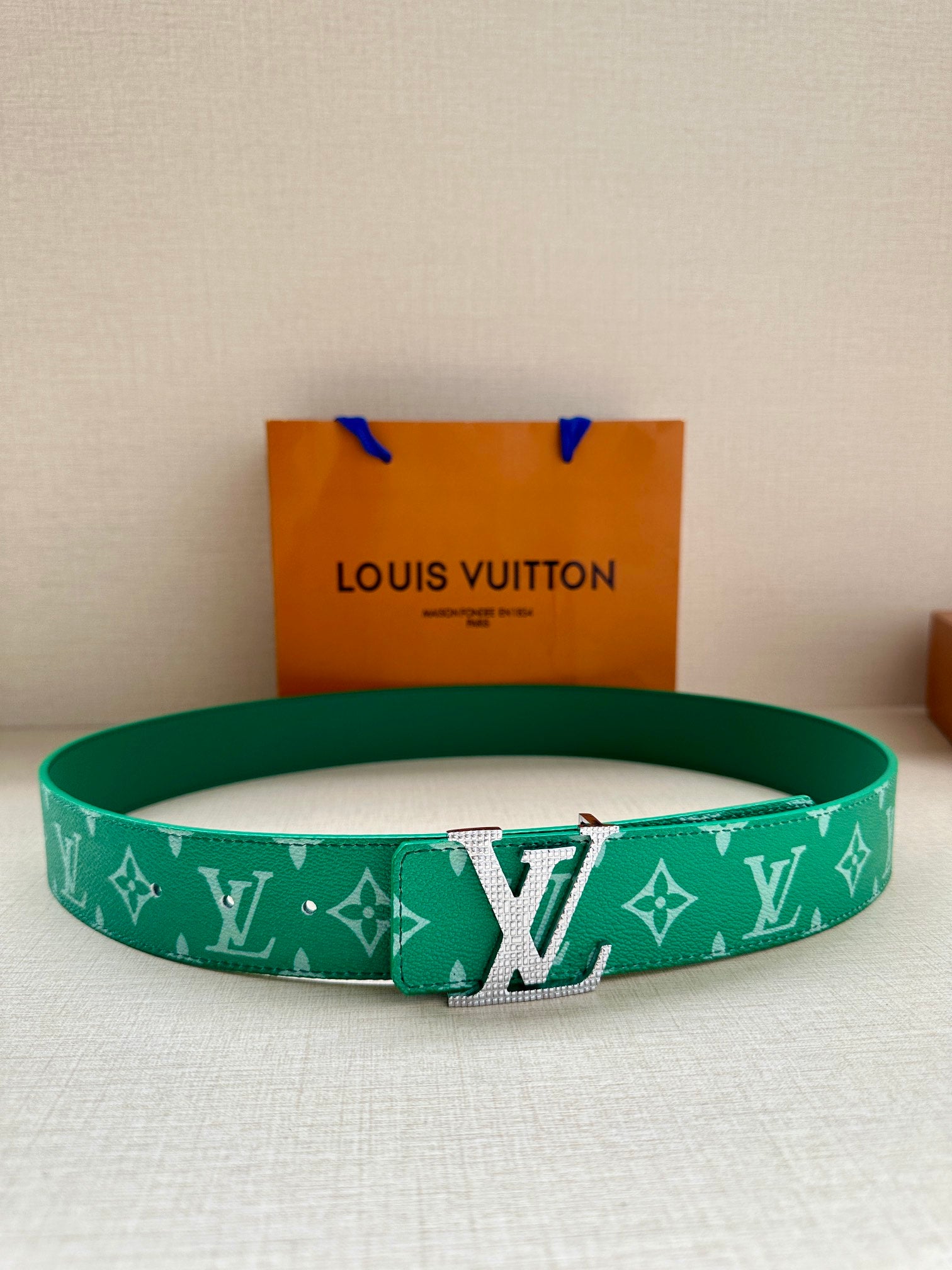 Louis Vuitton green logo belt with gold-tone buckle and adjustable holes